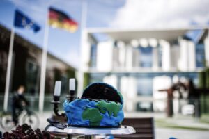 Activists stage protest to mark Earth Overshoot Day in Berlin