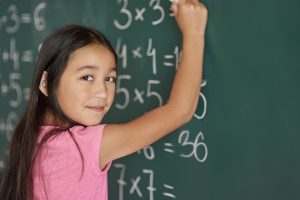 girl-making-some-exercises-blackboard (1)